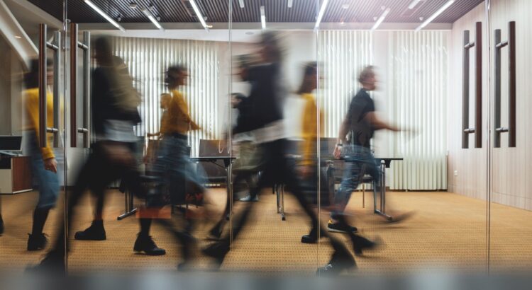 busy people walking inside an office