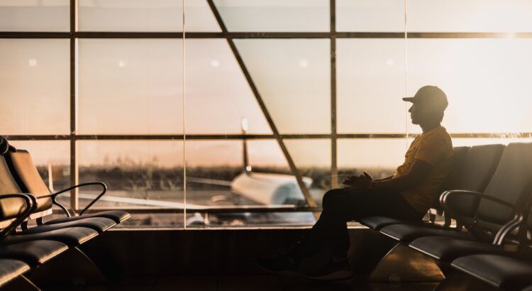 a person waits in an airport lounge
